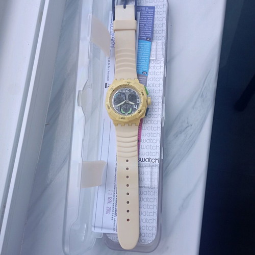 Swatch unisex watch with new yellow silicone strap, like new