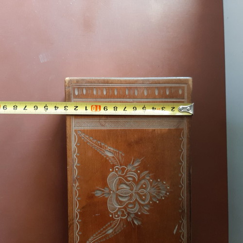 Wooden jewelry box used with carved decorations and red lining