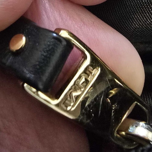 Tumi backpack used, black with gold details