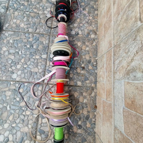 Wooden base with ribbons used for jewelry