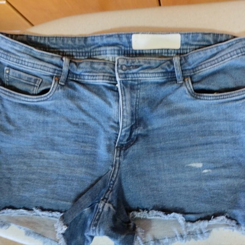 Denim shorts used, size 38, blue with frayed hem