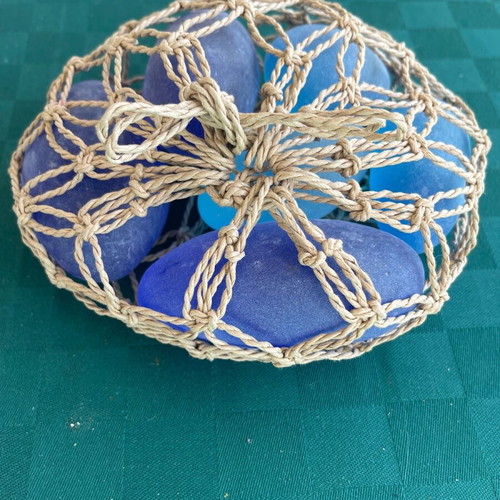 Doorstop made of pebbles like new, blue and light blue