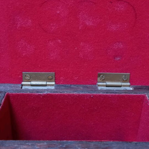 Decorative small wooden chest used with metal details