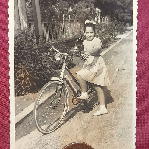 Vintage black and white photo of girl with bicycle, like new