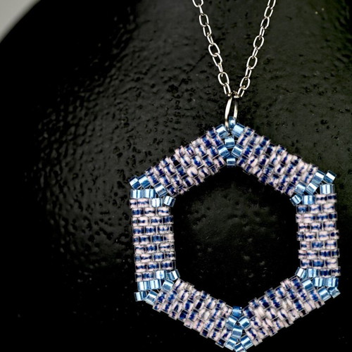 Custom-made jewelry set in light blue tones with hexagonal pendant