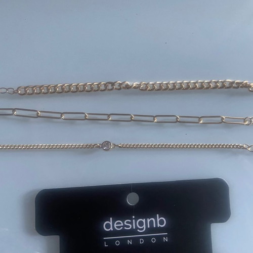 Three gold plated bracelets Design Letters used
