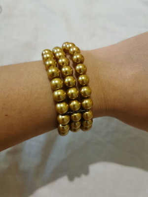 Bracelet with 3 rows of pearls in gold color like new