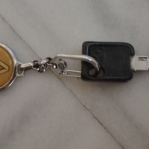 Renault keychain used, metal, yellow