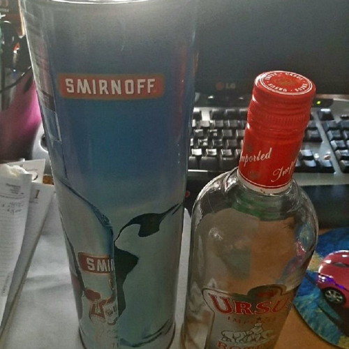 Smirnoff collectible tin and Ursus Rotter red bottle used