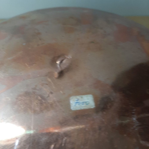 Large copper bowl used with carved details
