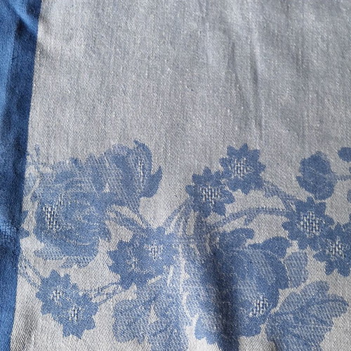 Aegean blue cotton tablecloth with floral woven patterns and lace trim