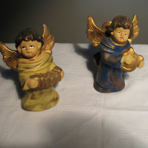 Pair of old clay angels like new
