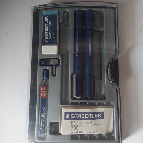 Staedtler drawing set used with rapidograph 0.4 and 0.6, eraser, compass adapter, and 0.5 leads