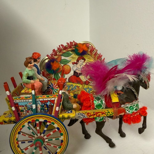 Vintage Sicilian cart with horse and tambourine decoration