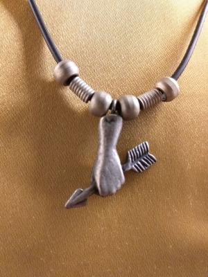 Short necklace used with hand holding arrow pendant in white metal