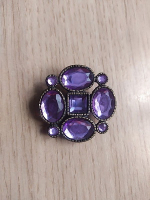 Brooch with purple stones used