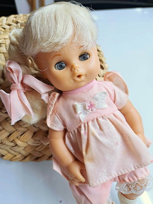 Vintage baby doll like new with dress and bottle