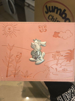 Children's photo album used, pink with embossed designs