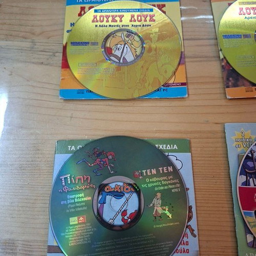 Collection of 10 children's animated DVDs with cases, dubbed
