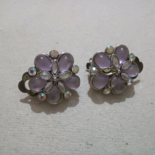 Earrings used with clip missing one rhinestone