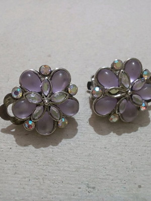 Earrings used with clip missing one rhinestone