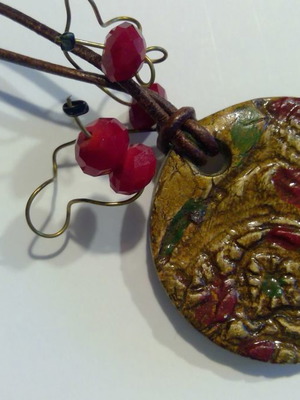 Necklace with embossed leather motif new, long with red beads