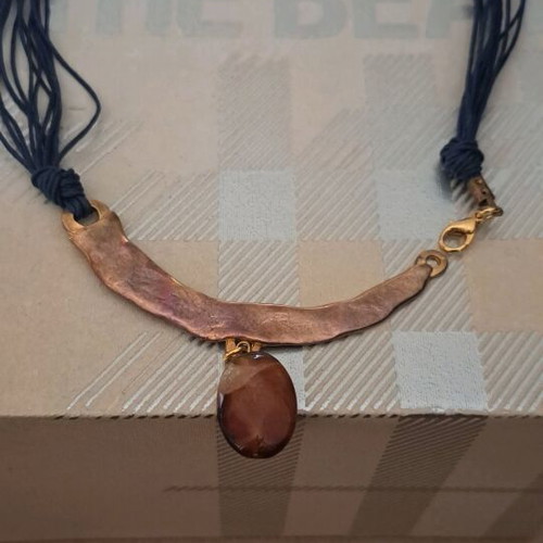 Handmade necklace in excellent condition with metal and stone