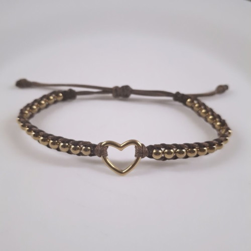 Handmade bracelet with gold beads and steel heart