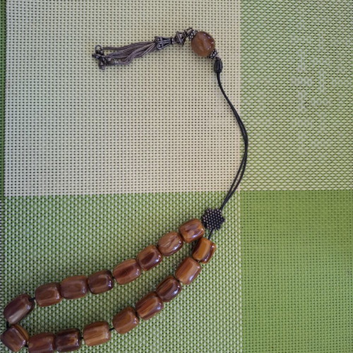 Komboloi with Brown-Honey Beads like new, 17 beads, metal decorations