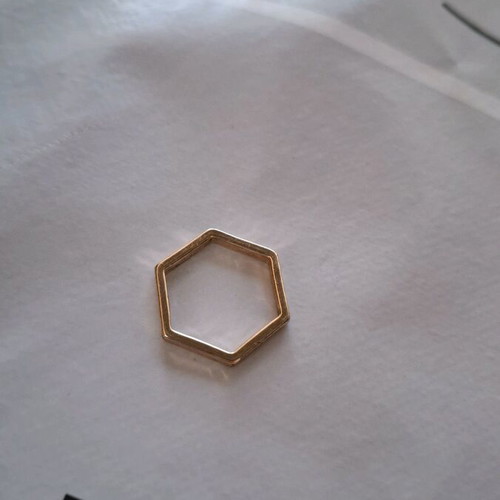 Hexagonal women's ring like new, gold color, size 19 or 20