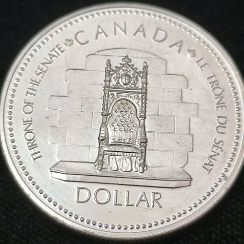 Canada Dollar 1977 commemorative edition like new, silver .500