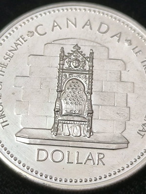 Canada Dollar 1977 commemorative edition like new, silver .500