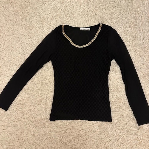 Black blouse used with gold metallic design and mesh sleeves