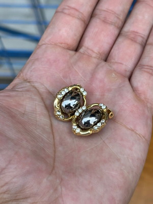Vintage clip-on earrings with rhinestones and smoky cabochon, used
