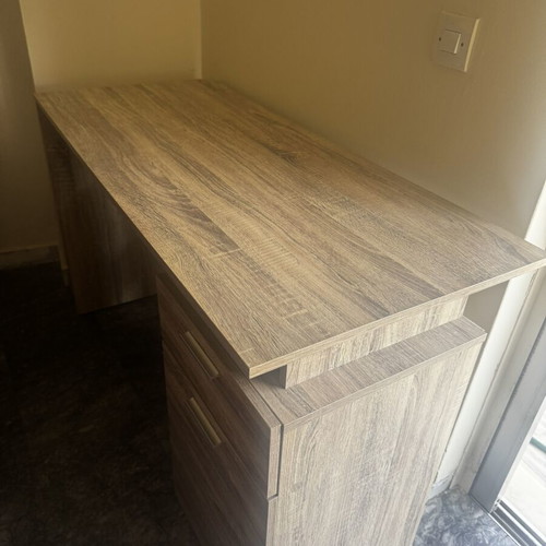 Wooden desk with drawer and open storage, brown oak finish