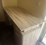 Wooden desk with drawer and open storage, brown oak finish