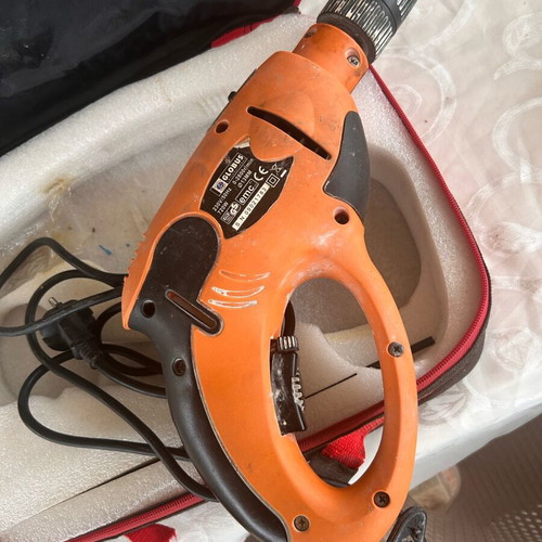 Globus impact drill used with large set of bits and sockets