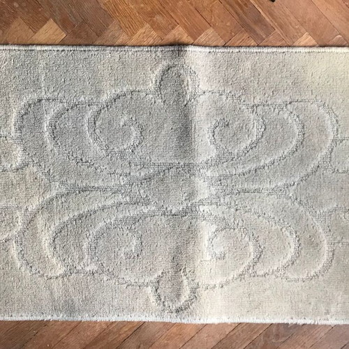 Beige rug with pattern and non-slip backing, new