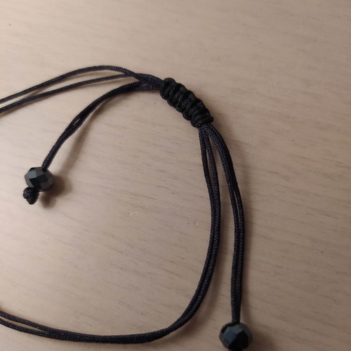Tear bracelet used with black cord