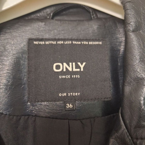 Only black biker jacket made of faux leather with silver details used