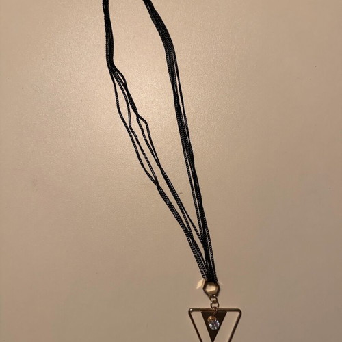 Pendant like new metal with 4-row black and gold chain with rhinestones