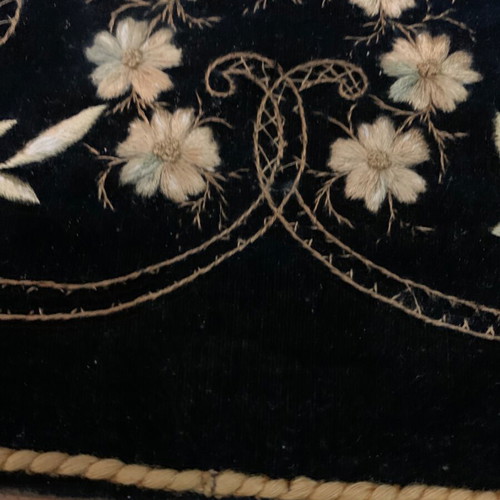 Traditional embroidery used, dark velvet
