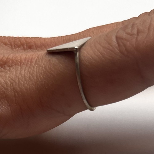 Triangular brass ring like new with thin band and textured finish
