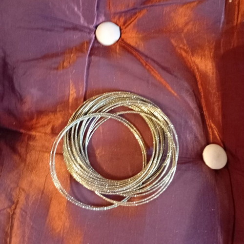 Bracelet made of 32 thin metal pieces like new, gold tone