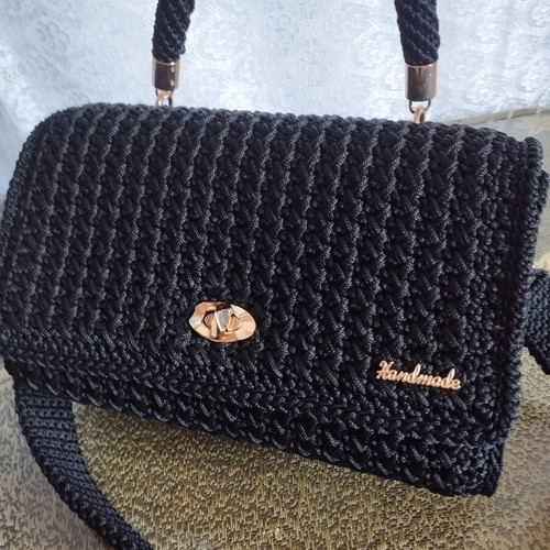 Knitted black handbag with gold accessories, handmade