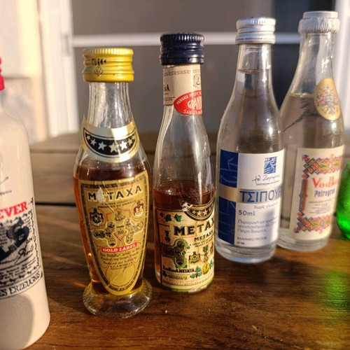 Collection of 7 collectible vintage sealed mini liquor bottles new