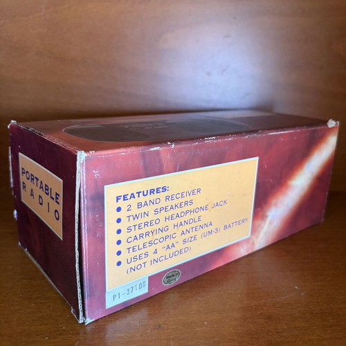 Portable radio with twin speakers