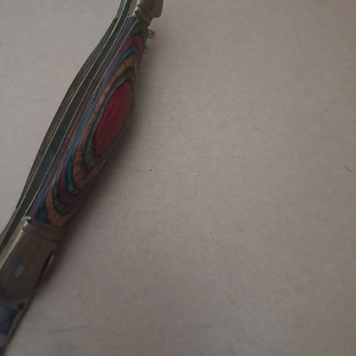 Vintage folding knife like new with multicolored wood handle