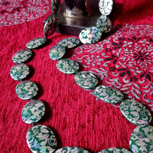 Acrylic green necklace used with holographic silver floral details