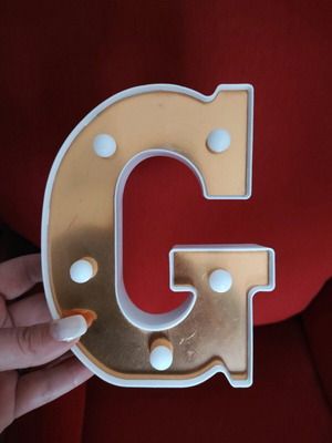 Led letter G used decorative light in gold color